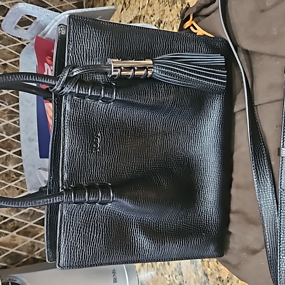 Tods black leather tassel bag. Like new. One day sale. Thursday